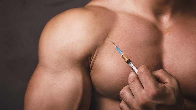 man injecting syringe