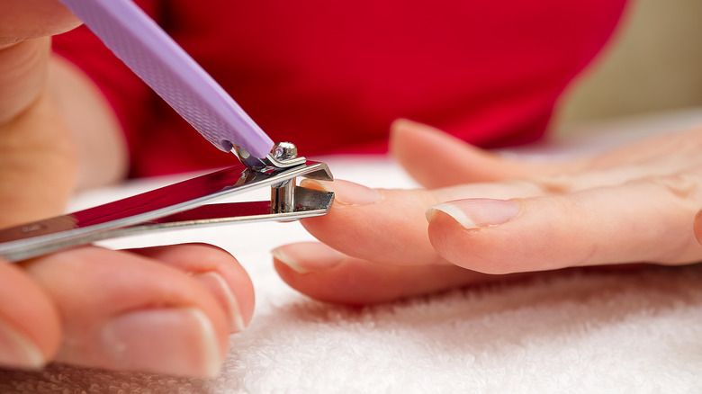 woman clipping nails