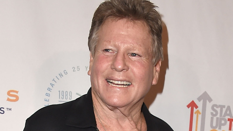 Ryan O'Neal smiling at event