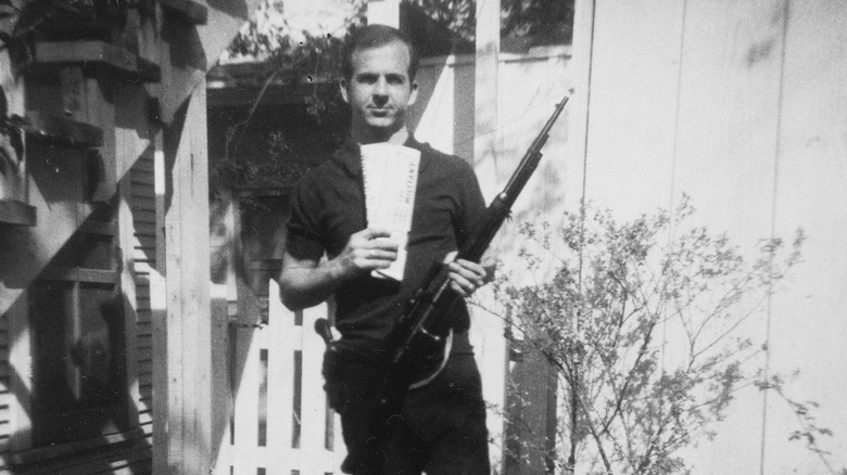 Lee Harvey Oswald holding gun