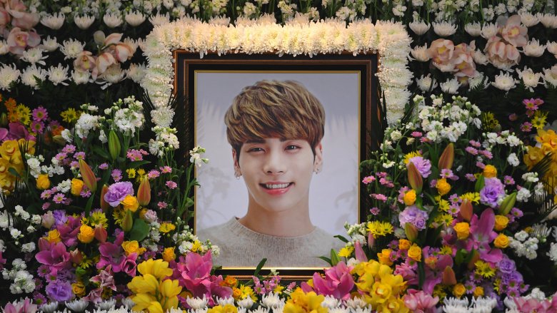 Jonghyun framed picture surrounded by flowers