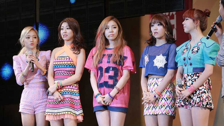 Ladies' Code standing on stage