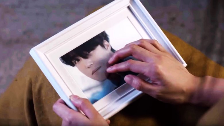 framed picture Tany being held