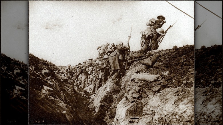 soldiers climbing out of trench