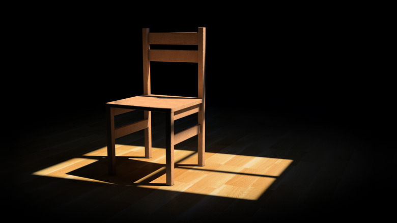 Chair on a dark room illuminated