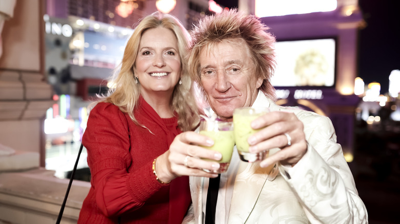 Penny Lancaster and Rod Stewart drinking together