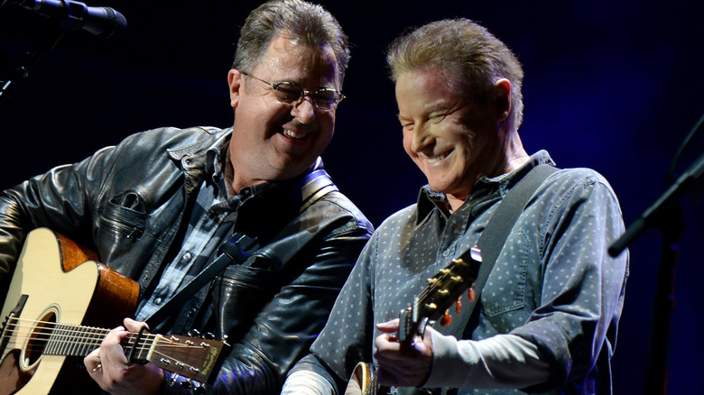 Vince Gill Don Henley Eagles playing guitars