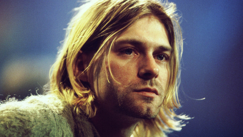Kurt Cobain leans forward