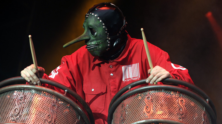 Chris Fehn face mask drums performing