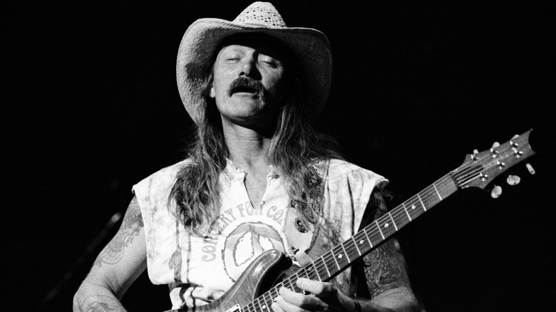 Dickey Betts playing guitar onstage