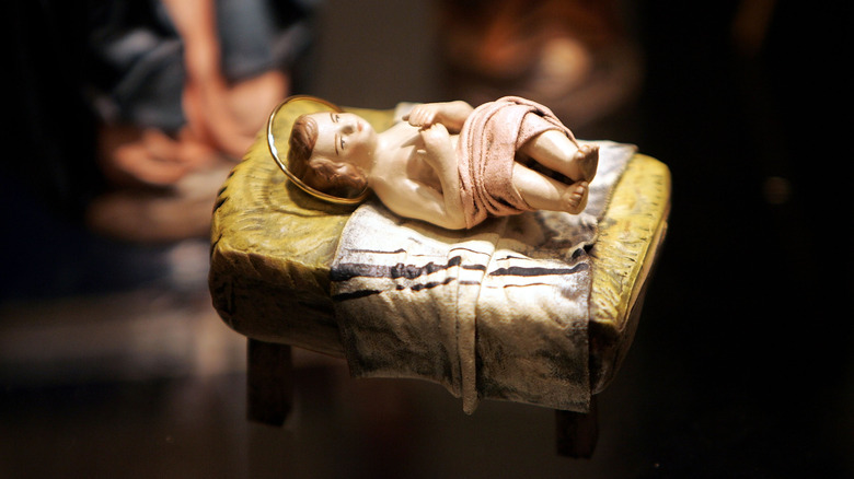 sculpture of baby jesus in manger