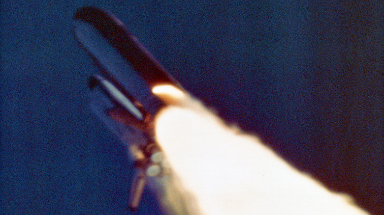challenger launching flames leaking from rockets
