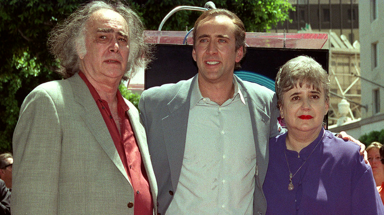 Nic Cage stands with father and mother