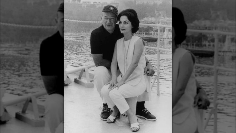 John Wayne and Pilar Pallete on a boat