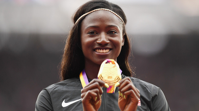 Tori Bowie holding gold medal