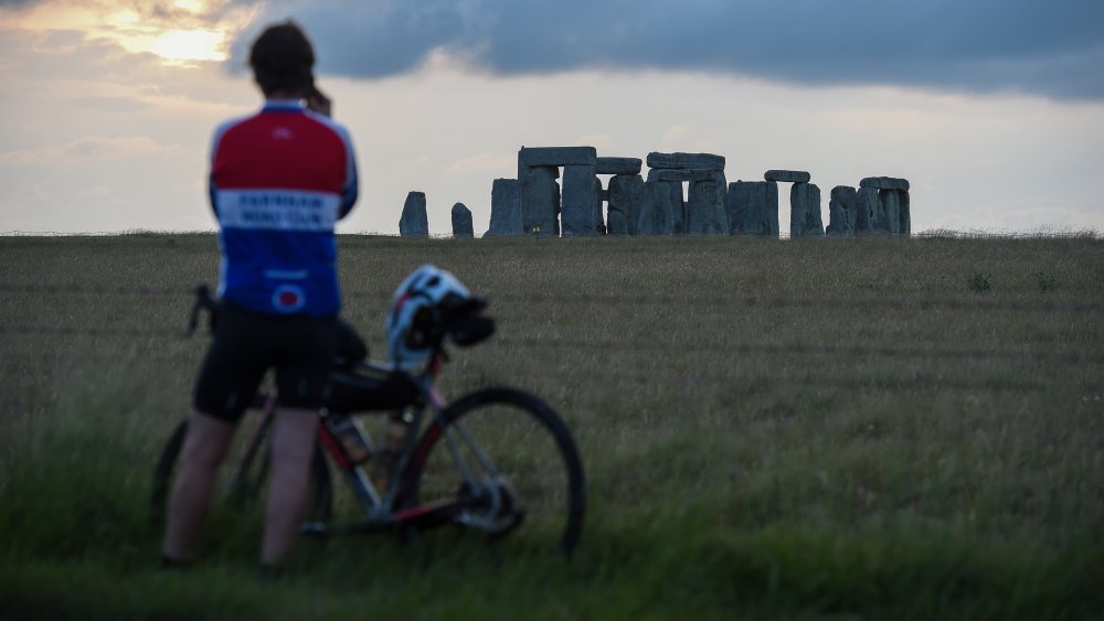 Bicyclist before Stonehenge