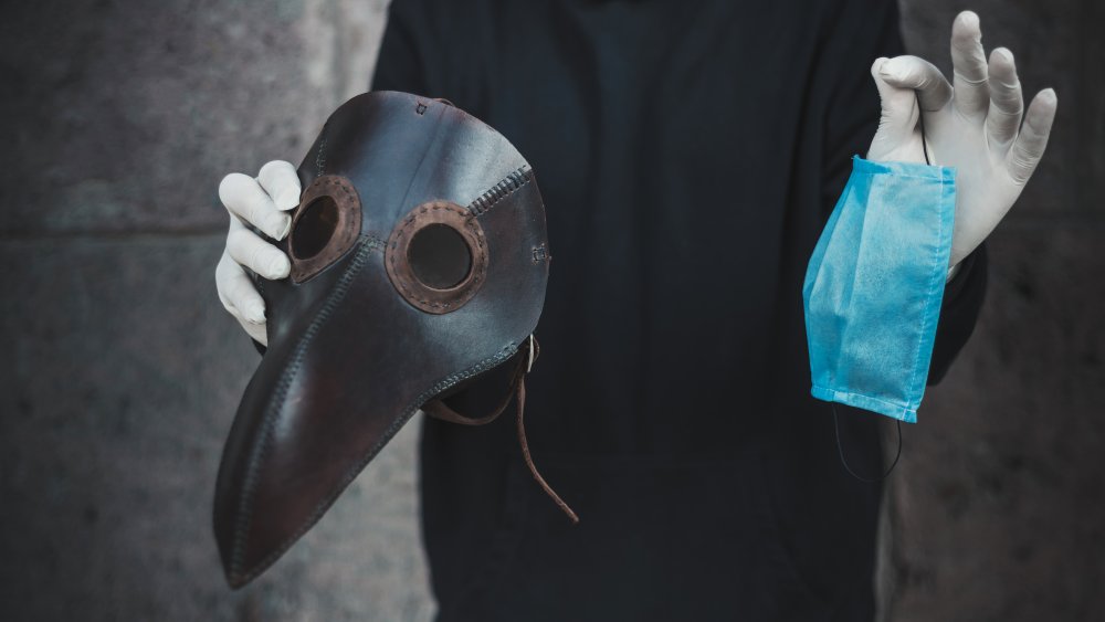 a plague mask and a modern mask