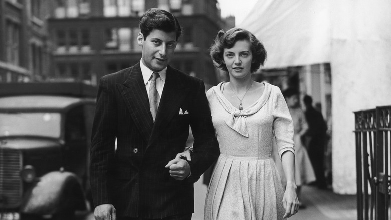 Man and woman walking in 1950s