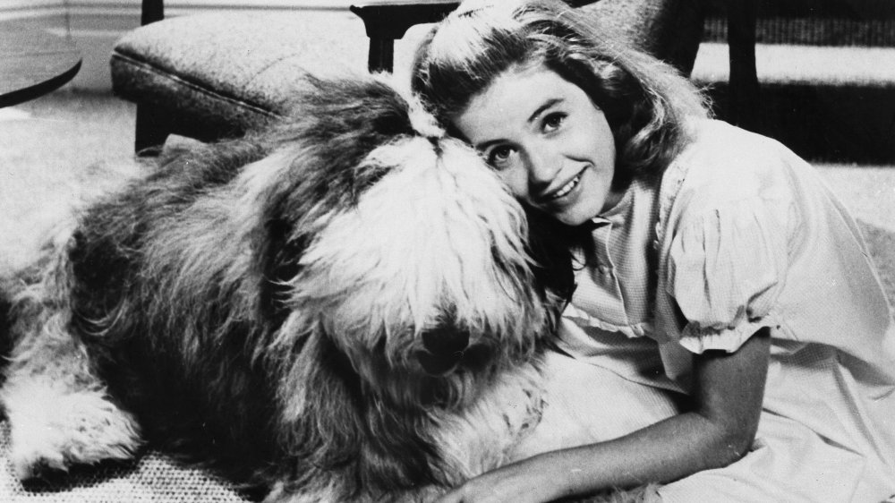 Patty Duke with a dog as a child