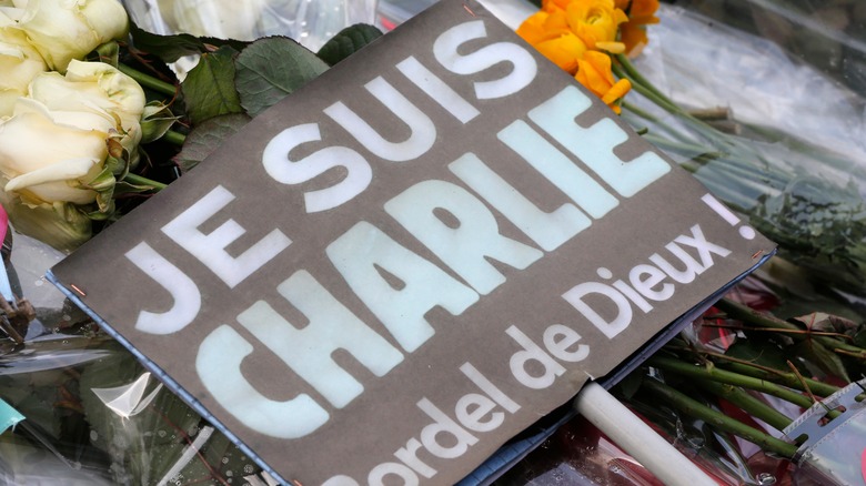 Memorial to Charlie Hebdo attack victims with Je Suis Charlie placard