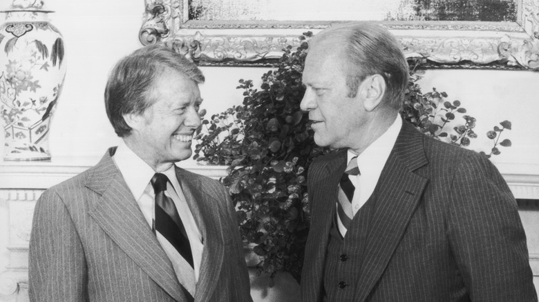 Ford and Carter with forced smiles 