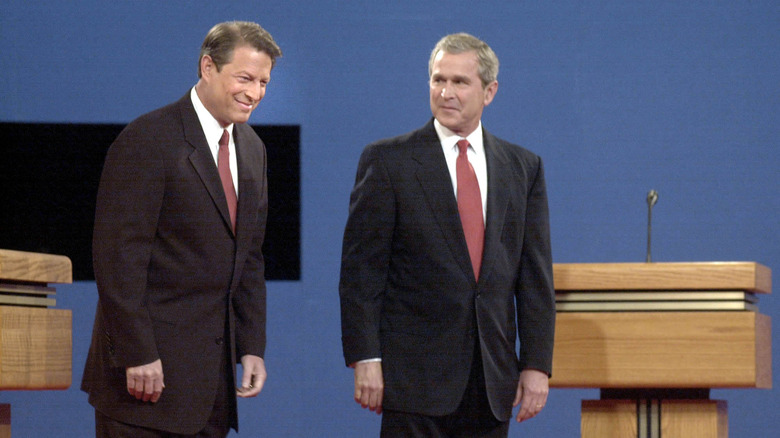 Al Gore and George W. Bush stand side by side