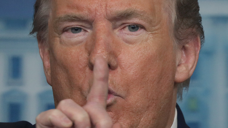 Donald Trump with finger on lips