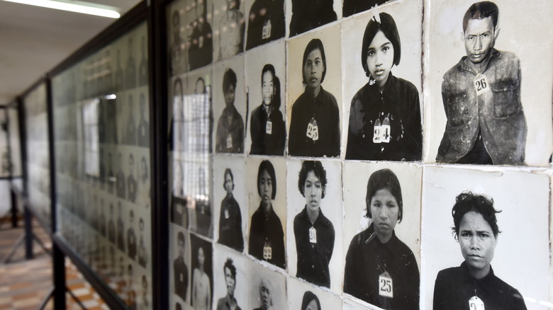 Line of photos in museum of victims during Pol Pot's rule