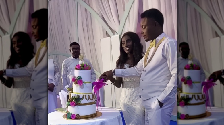 Eunice Dwumfour wedding cutting cake