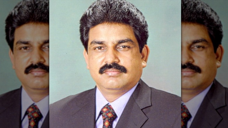 Shahbaz Bhatti suit moustache portrait