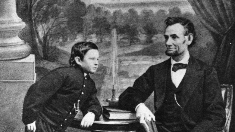 Tad and Abraham Lincoln sitting