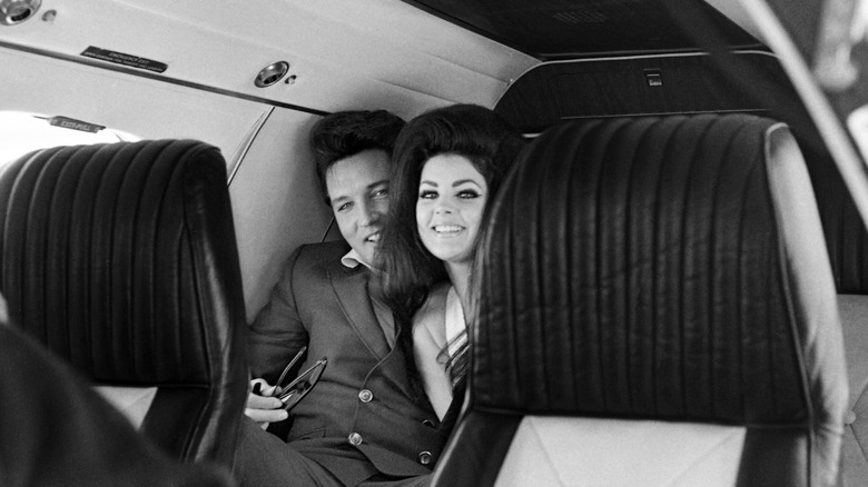 Priscilla and Elvis Presley on a plane