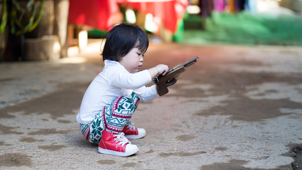 Little girl with a gun
