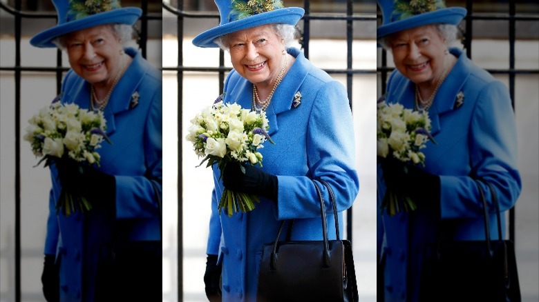The Queen with a black bag