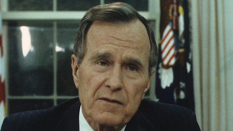 Bush seated at a desk