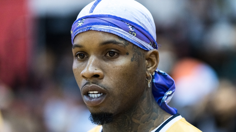 Tory Lanez in a blue and white durag