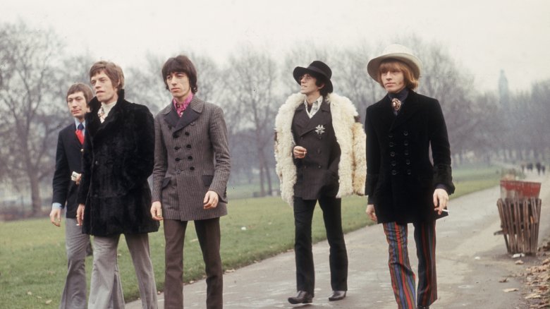 Brian Jones jacket walking in park with Rolling Stones