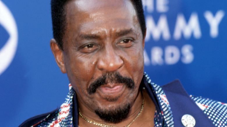 Ike Turner in blue suit and chain