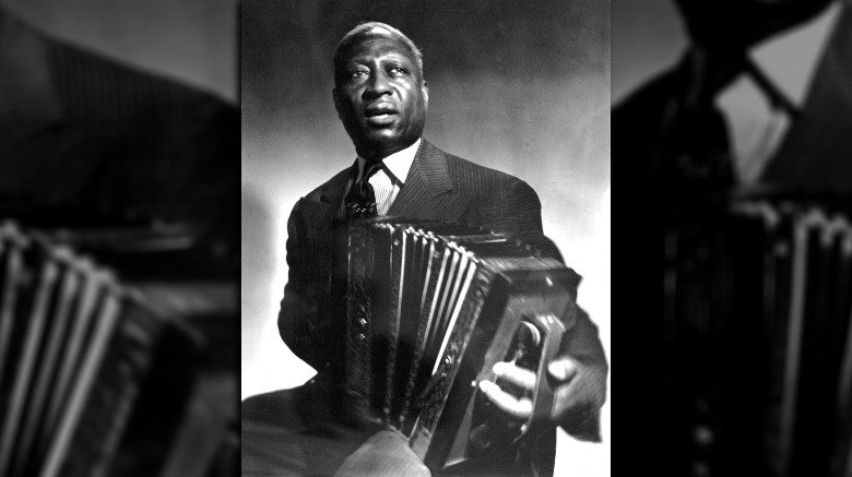 Lead Belly suit holding accordian