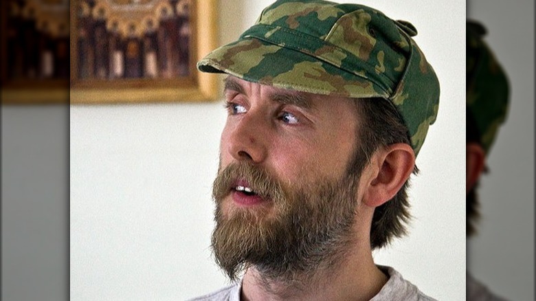 Vark Vikernes in camo cap with beard