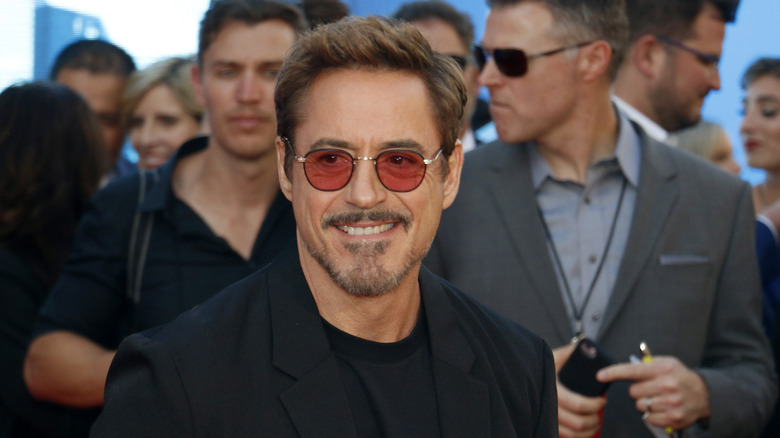 Robert Downey Jr. smiling sunglasses in a crowd