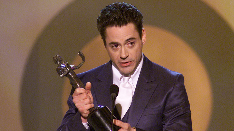 Robert Downey Jr. suit holding Golden Globe