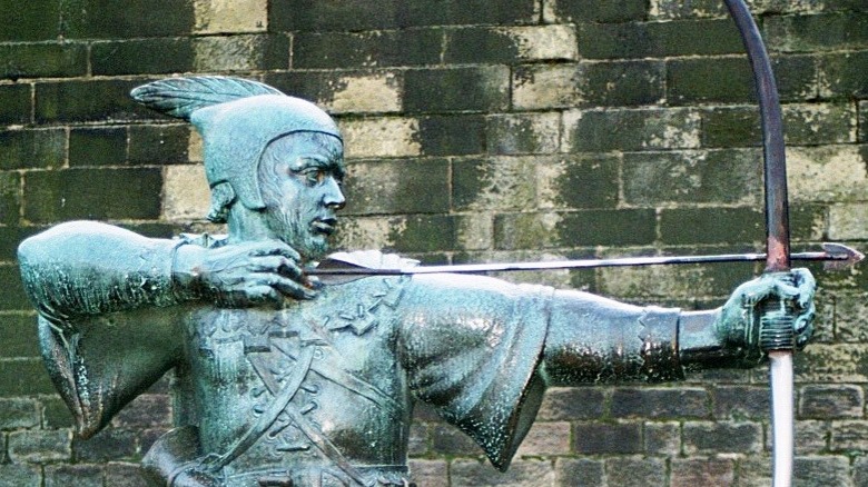 Statue of Robin Hood with bow and arrow