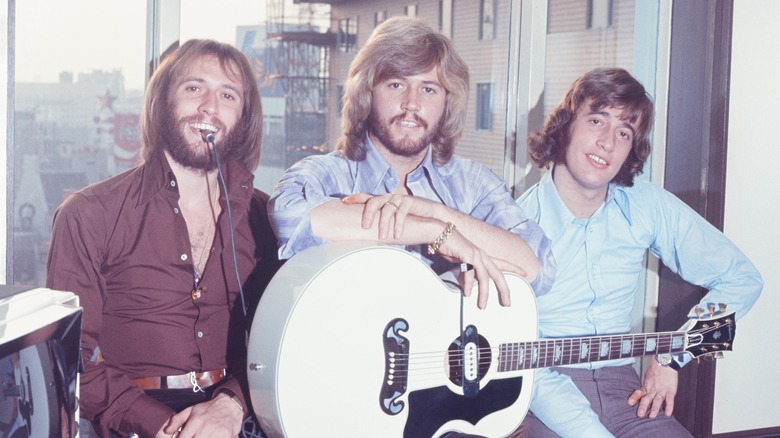 The Bee Gees posing for a photo