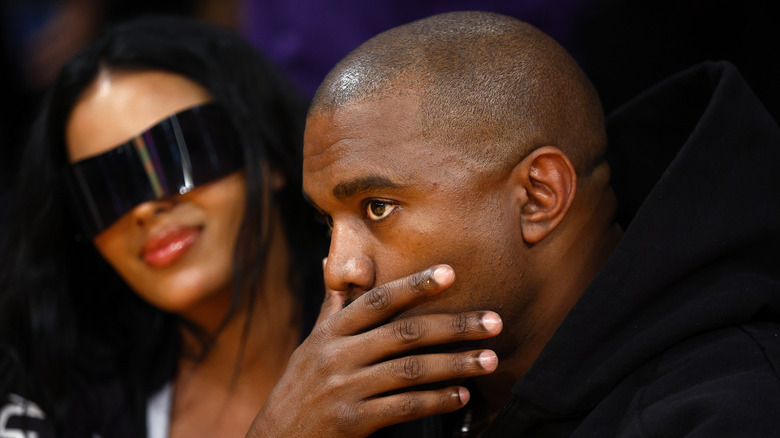 Kanye West watching basketball