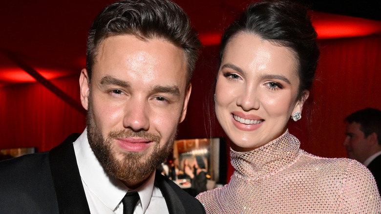 Liam Payne and Maya Henry smiling at event