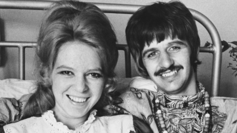Ringo Starr and Maureen Cox smiling in a bed