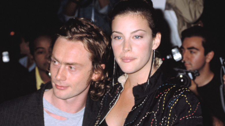 Royston Langdon and Liv Tyler looking off