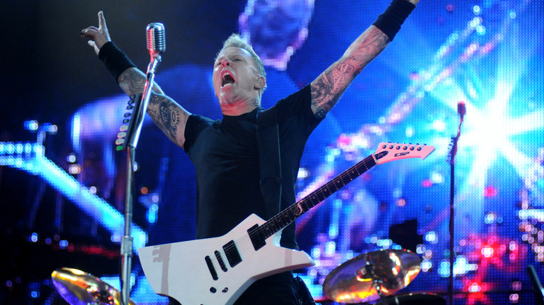 James Hetfield holding arms up