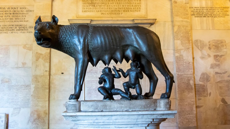 a statue of a wolf suckling babies